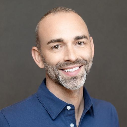 headshot photo of Phil Burrows